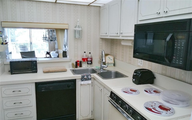 kitchen with white cabinets, black appliances, and sink