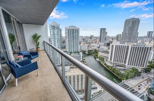 balcony featuring a water view