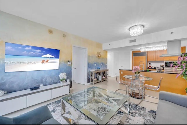 living room featuring a notable chandelier