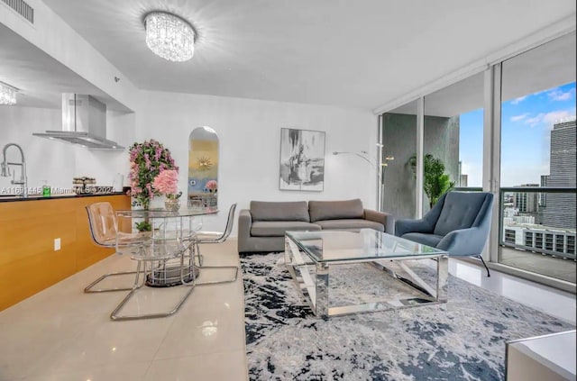 tiled living room with sink and a wall of windows