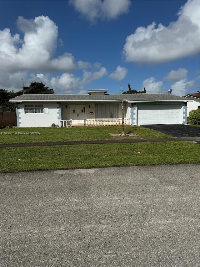 single story home with a front lawn and a garage