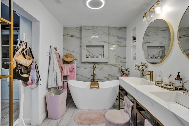 bathroom featuring vanity and a bathtub