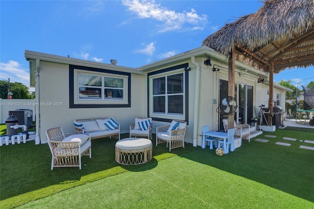 rear view of house with a yard and central air condition unit