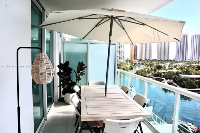 balcony featuring a water view