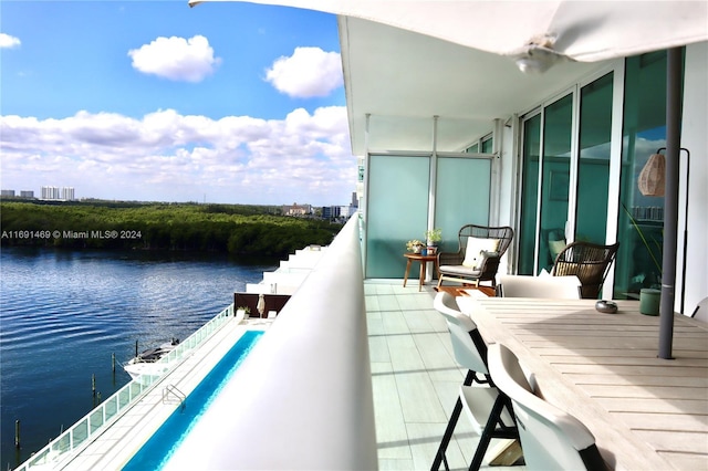 balcony featuring a water view