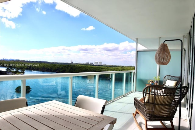 balcony featuring a water view