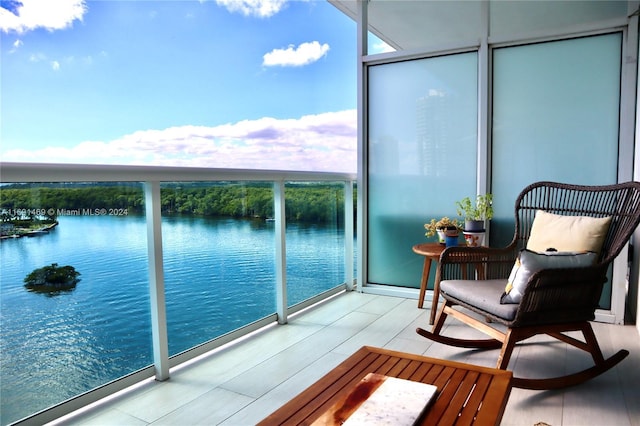 balcony featuring a water view