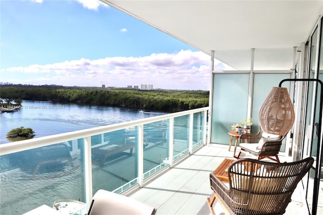 balcony featuring a water view