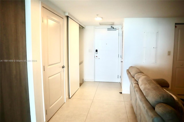 hall with light tile patterned flooring