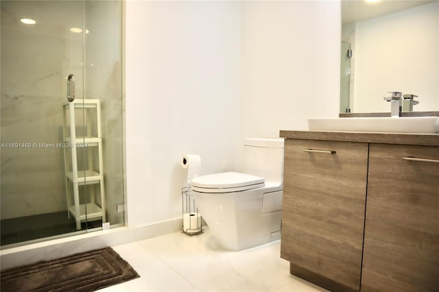 bathroom featuring tile patterned floors, vanity, an enclosed shower, and toilet