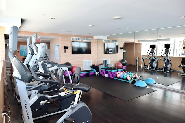 workout area with hardwood / wood-style flooring