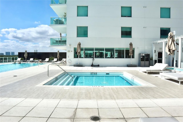 view of pool featuring a patio