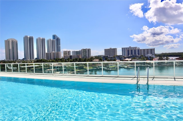 view of pool with a water view