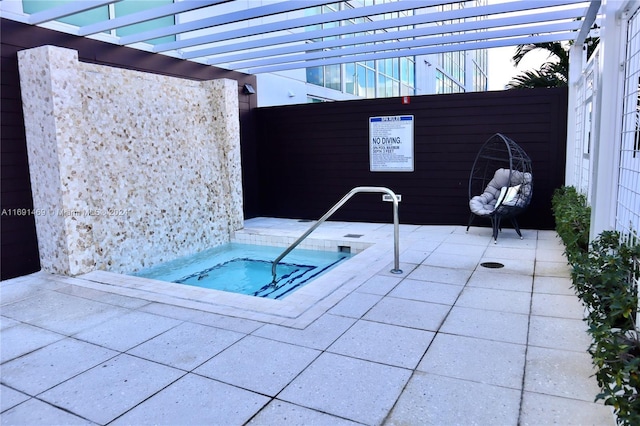 view of pool with a pergola and a hot tub