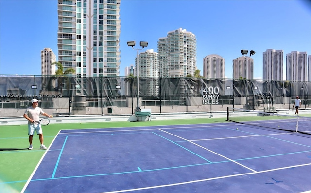 view of tennis court with basketball court