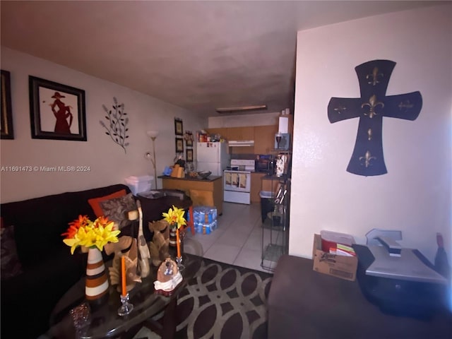 living room with ceiling fan and light tile patterned flooring