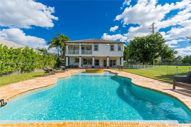 view of pool featuring a lawn, ceiling fan, and a patio area