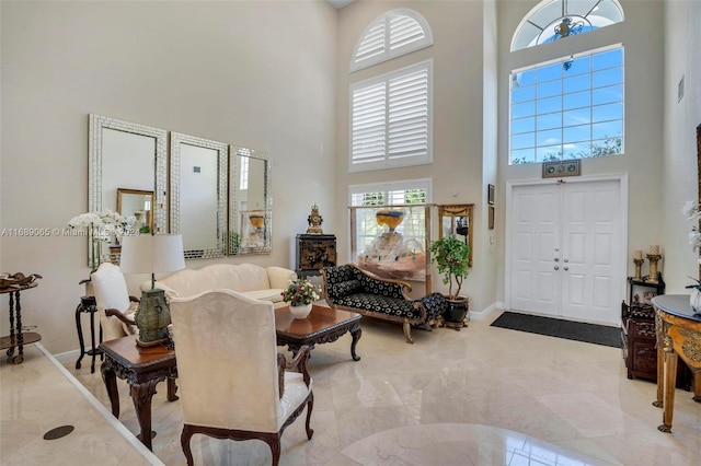 foyer entrance with a towering ceiling