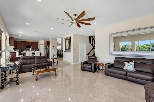 living room featuring ceiling fan