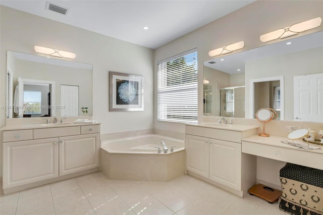 bathroom featuring tile patterned flooring, vanity, and separate shower and tub