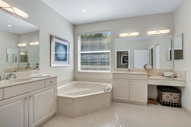 bathroom featuring tile patterned flooring, a bath, and vanity