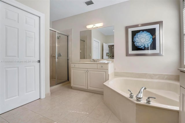 bathroom with vanity, tile patterned floors, and independent shower and bath