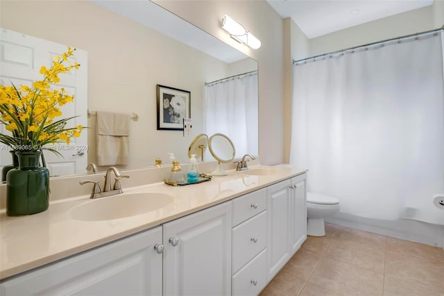 full bathroom featuring tile patterned floors, vanity, toilet, and shower / tub combo with curtain