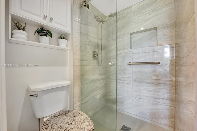 bathroom with walk in shower and toilet