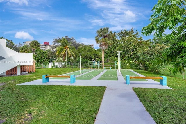 view of home's community featuring a lawn