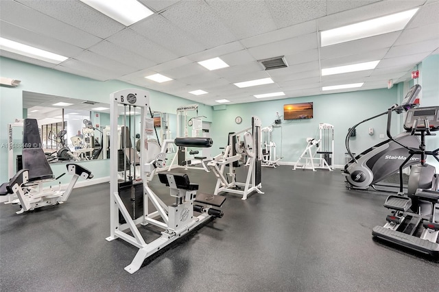 gym with a drop ceiling