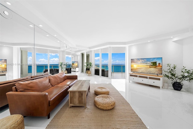 tiled living room featuring expansive windows