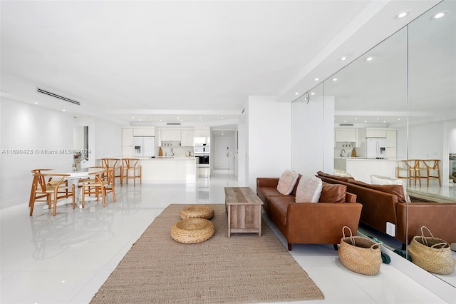 living room with light tile patterned floors