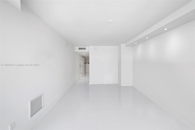 corridor featuring light tile patterned floors