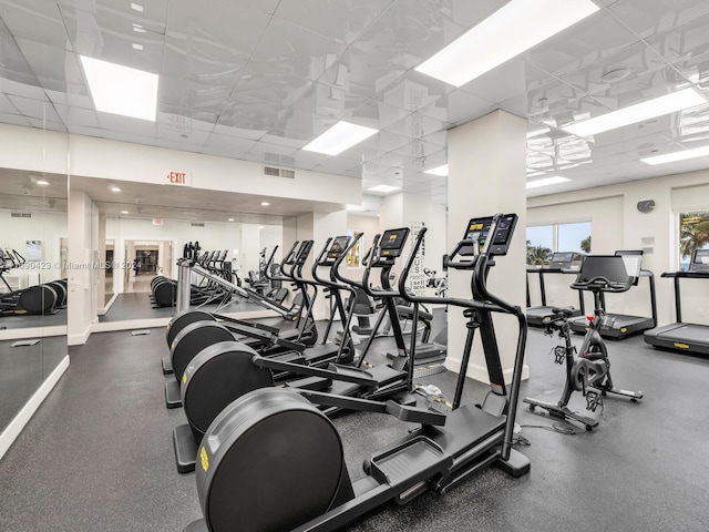 gym featuring a paneled ceiling