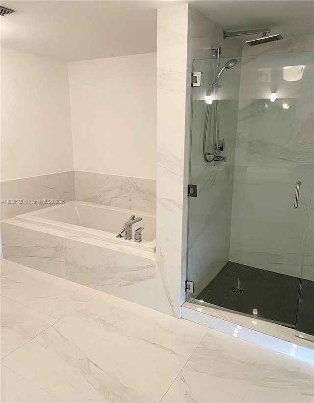 bathroom with independent shower and bath