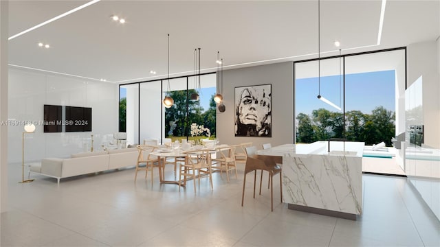 dining space featuring a wall of windows, plenty of natural light, and light tile patterned floors