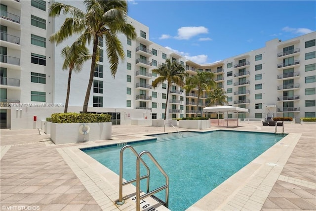 view of swimming pool with a patio