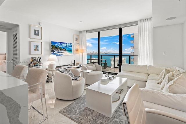 living room featuring floor to ceiling windows