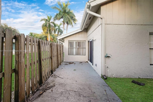 view of side of property with a patio