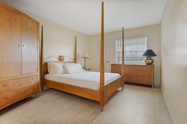 bedroom featuring a textured ceiling