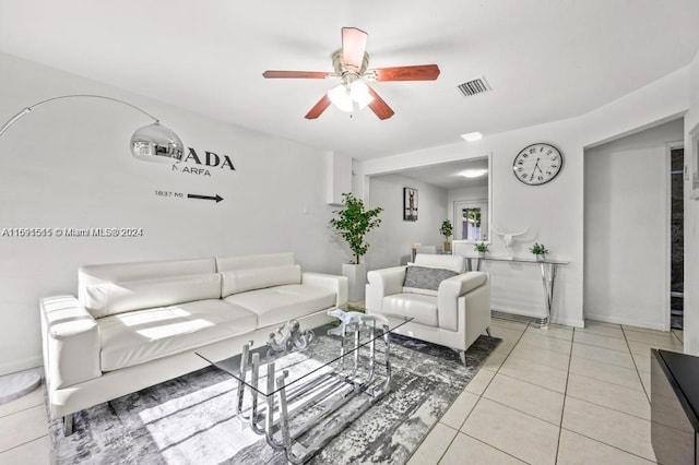 living room with ceiling fan and light tile patterned floors