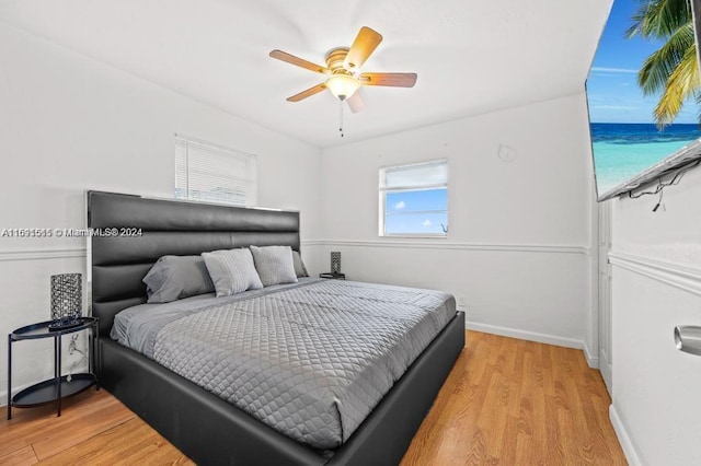 bedroom featuring ceiling fan and light hardwood / wood-style flooring