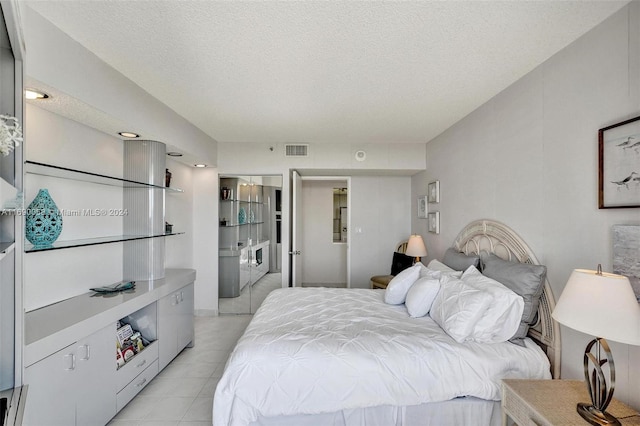 bedroom featuring a textured ceiling