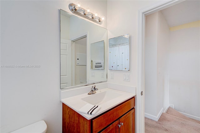 bathroom with vanity and toilet