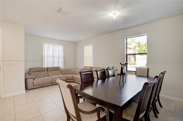 dining space with light tile patterned floors