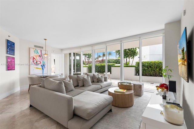 living room featuring floor to ceiling windows