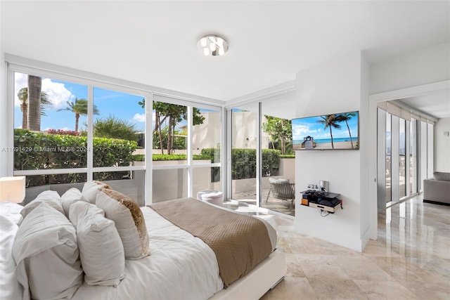 bedroom featuring access to outside and multiple windows