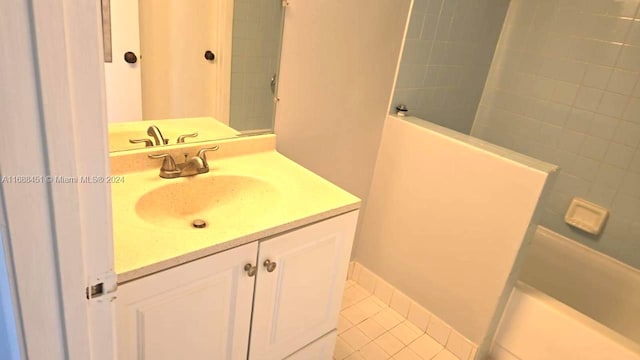 bathroom featuring tile patterned flooring and vanity