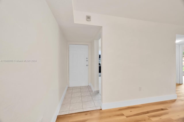 hall with light hardwood / wood-style floors