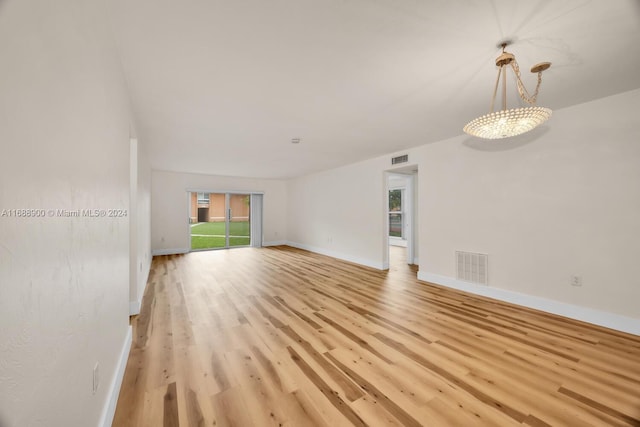 unfurnished living room with light hardwood / wood-style flooring